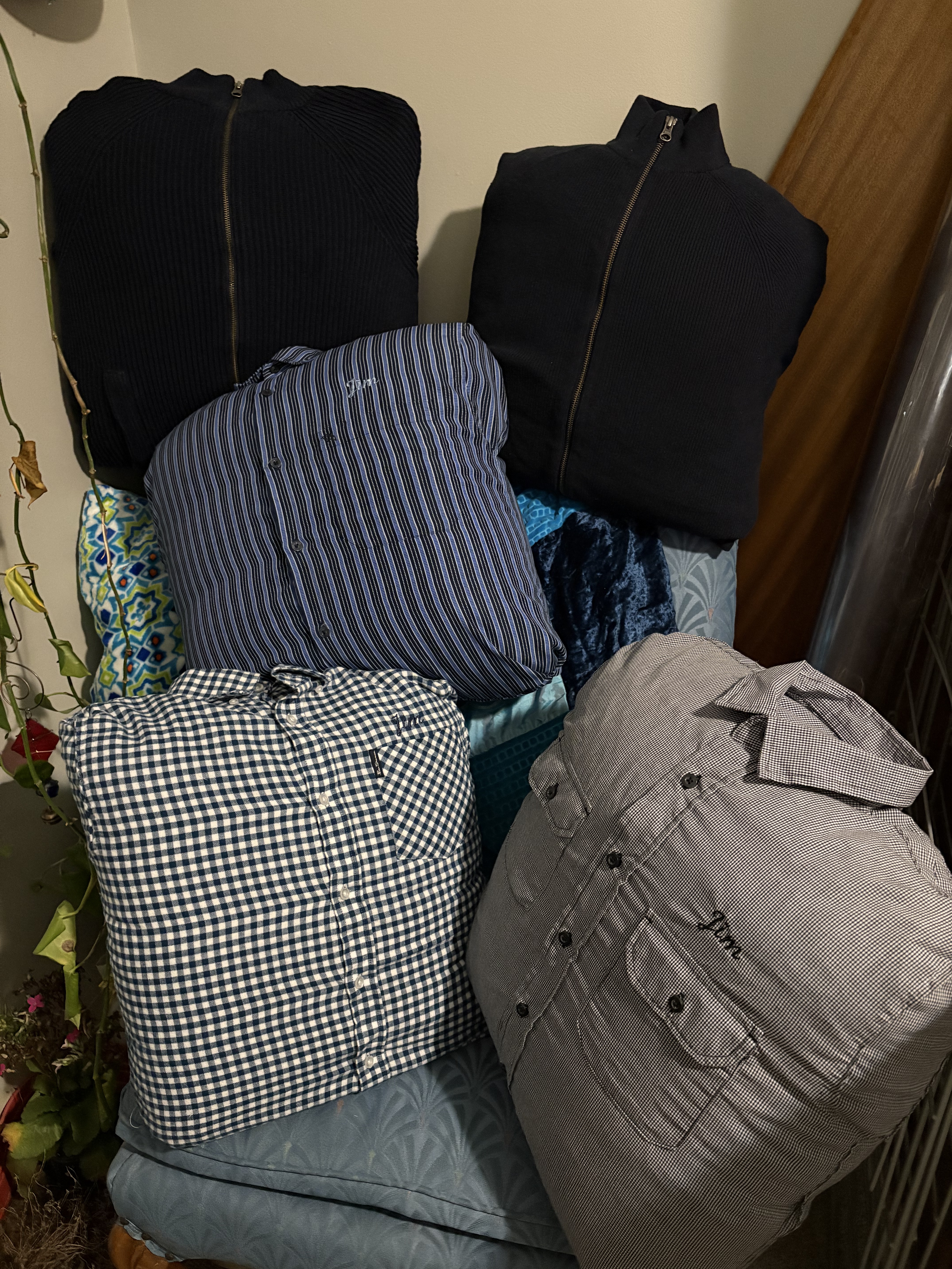 Five pillows made from shirts and sweatshirts